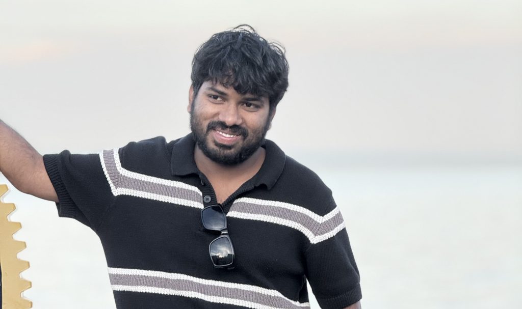 Photo of aslam smiling 